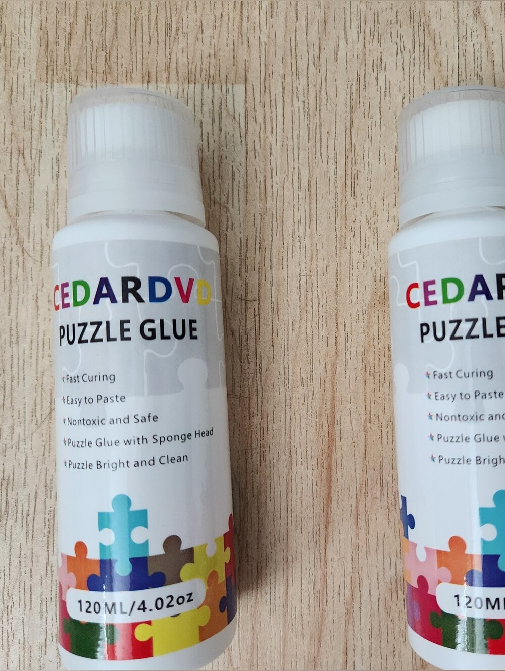 CEDARDV Puzzle Glue - White Bottle with Multicolor Puzzle Graphic. Brand New.